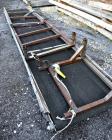 Used Uni-Shred Single Shaft Shredder, Carbon Steel. Approximately 14” diameter x 44” wide rotor with bolt-on cutters. Approximately 40-1/2” x 44-1/2” feed opening with hopper. Single ram horizontal h...