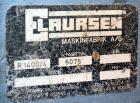 Used Eldan Recycling / E. Laursens Rasper, Model R1400/4, Carbon Steel. (1) Single shaft with wedge mounted blades. Hydraulically driven. Includes a feed hopper, and stand. Designed for preparing for...