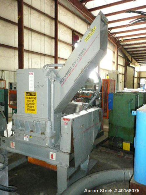 Used Polymer Systems 16" X 26" Scrap Grinder, model 1626. 3 knife open rotor with scissors cut. Includes 100 hp motor, standard tray feed hopper with auxiliary pipe feed chute, spare blades and blowe...