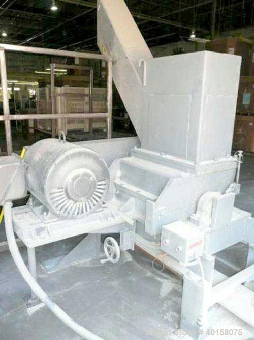 Used Polymer Systems 16" X 26" Scrap Grinder, model 1626. 3 knife open rotor with scissors cut. Includes 100 hp motor, standard tray feed hopper with auxiliary pipe feed chute, spare blades and blowe...