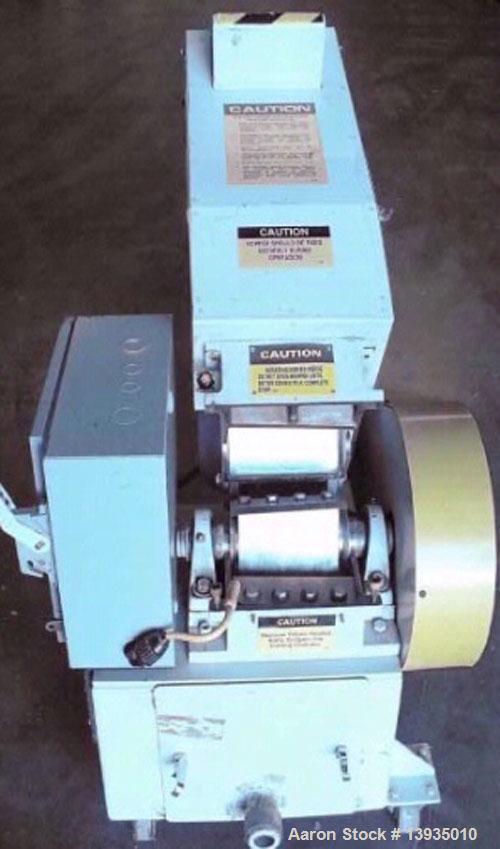 Used 2000 Battenfeld Gloucester Model 68-BP-5. Throat opening size 8" x 6", 2 rotor knives, 1 bed knife, 5 hp, rides on casters.