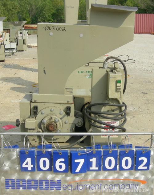 Used Conair/Wortex Granulator, model LP-330. Approximate 6" diameter x 7" long segmented helical type rotor with 3 rows of 5 blades. 7 3/4" x 7 1/4" carbon steel chamber. 12" x 12" top feed opening. ...
