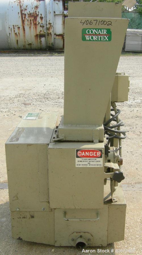 Used Conair/Wortex Granulator, model LP-330. Approximate 6" diameter x 7" long segmented helical type rotor with 3 rows of 5 blades. 7 3/4" x 7 1/4" carbon steel chamber. 12" x 12" top feed opening. ...