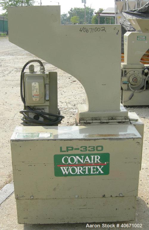 Used Conair/Wortex Granulator, model LP-330. Approximate 6" diameter x 7" long segmented helical type rotor with 3 rows of 5 blades. 7 3/4" x 7 1/4" carbon steel chamber. 12" x 12" top feed opening. ...