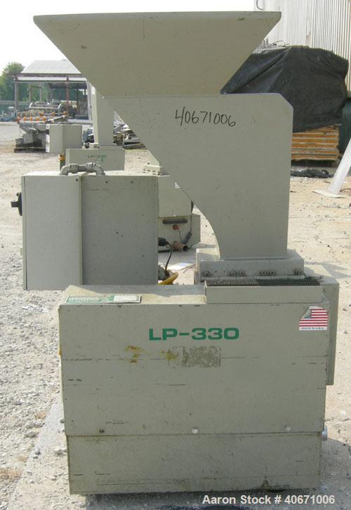 Used Conair/Wortex Granulator, model LP-330. Approximate 6" diameter x 7" long segmented helical type rotor with 3 rows of 5 blades. 7 3/4" x 7 1/4" carbon steel chamber. 24" x 24" top feed opening. ...