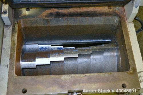 Used Conair Granulator, Model LP-814, Carbon Steel. Involute parabolic segmented helical type rotor with 7 rows of blades. Approximate 13-3/4" x 8" feed with a tilt back hopper. Approximate 1/8’’ dia...