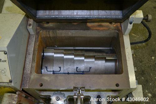 Used Conair Granulator, Model LP-814, Carbon Steel. Involute parabolic segmented helical type rotor with 7 rows of blades. Approximate 13-3/4" x 8" feed with a tilt back hopper. Approximate 1/8’’ dia...