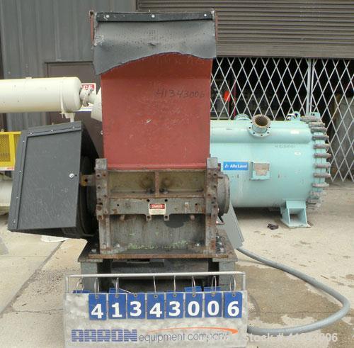 Used Cumberland Granulator, Model 24 GRAN-3KN. 3 bolt on blade, closed rotor. Approximate 18" x 24" feed with hopper, bottom discharge with screen. Driven by a 75 hp, 3/60/230/460 volt, 1785 rpm moto...