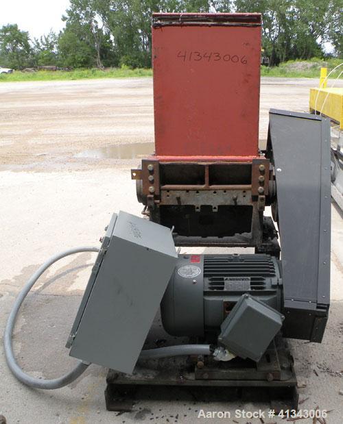 Used Cumberland Granulator, Model 24 GRAN-3KN. 3 bolt on blade, closed rotor. Approximate 18" x 24" feed with hopper, bottom discharge with screen. Driven by a 75 hp, 3/60/230/460 volt, 1785 rpm moto...