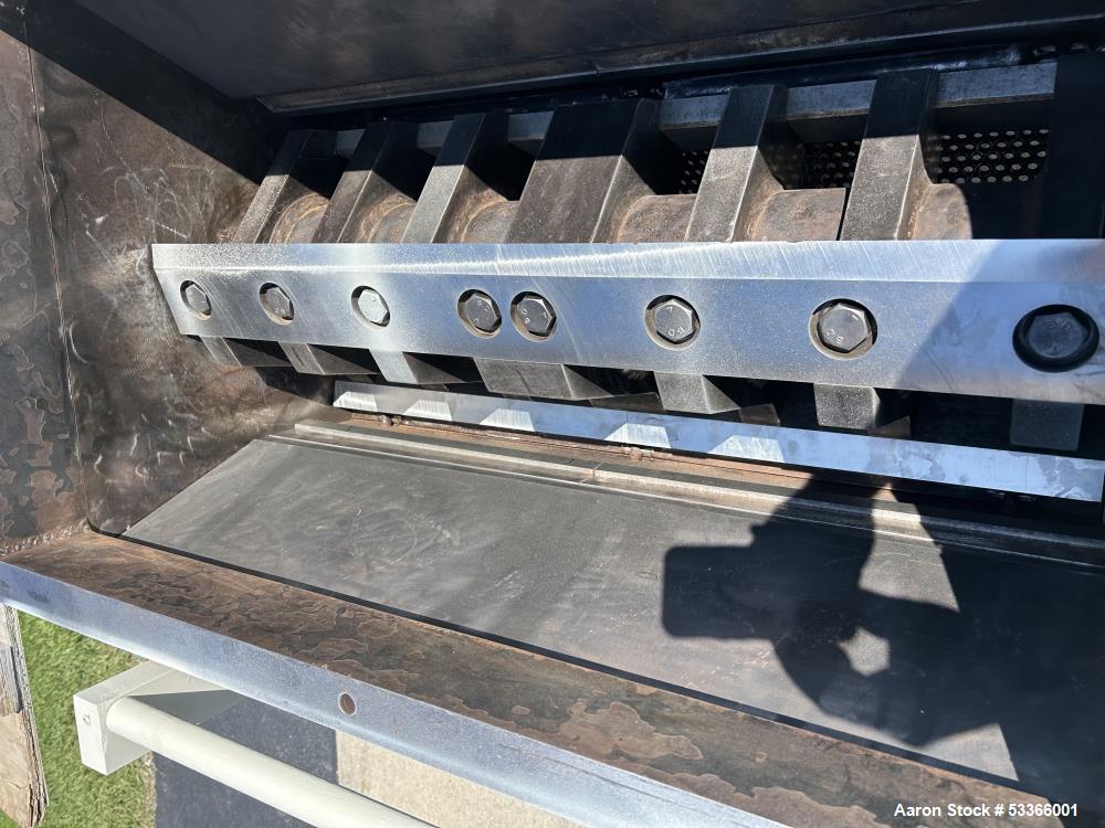 Used Cumberland Model 1837B granulator. 18" x 37" feed throat. 3 knife high shear rotor with two bed knives. Belt driven rotor by a 100 HP,  3/60/230/460 volt, 1775 RPM motor. Tray in-feed hopper. 84...