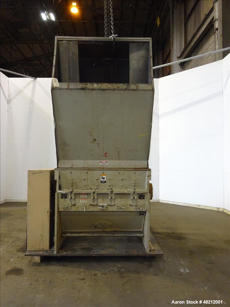 Used Cumberland X-Series  Granulator,  Model X1400. Approximate 24" x 56" feed throat with a tilting feed hopper. 5 Knife twin shear / high shear rotor, 2 bed knife, belt driven by a 150 hp 3/60/460 ...