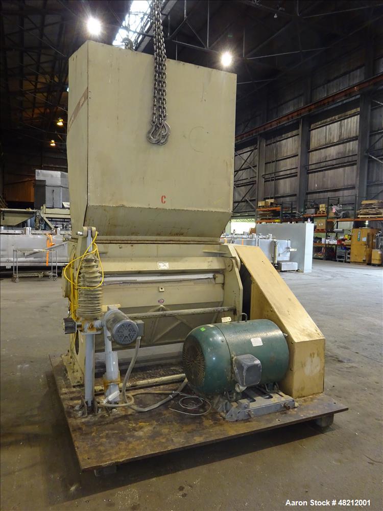 Used Cumberland X-Series  Granulator,  Model X1400. Approximate 24" x 56" feed throat with a tilting feed hopper. 5 Knife twin shear / high shear rotor, 2 bed knife, belt driven by a 150 hp 3/60/460 ...