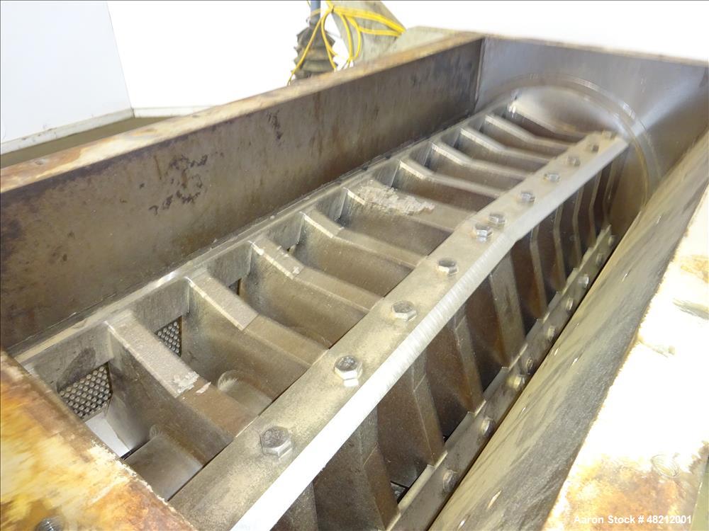 Used Cumberland X-Series  Granulator,  Model X1400. Approximate 24" x 56" feed throat with a tilting feed hopper. 5 Knife twin shear / high shear rotor, 2 bed knife, belt driven by a 150 hp 3/60/460 ...