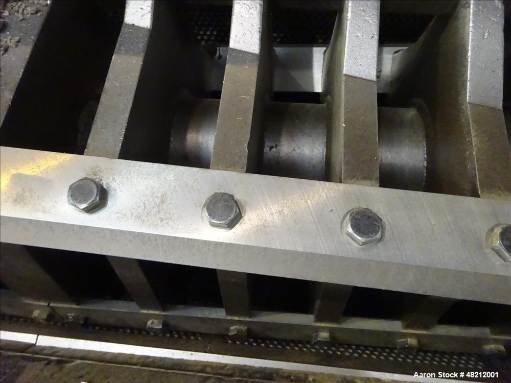 Used Cumberland X-Series  Granulator,  Model X1400. Approximate 24" x 56" feed throat with a tilting feed hopper. 5 Knife twin shear / high shear rotor, 2 bed knife, belt driven by a 150 hp 3/60/460 ...