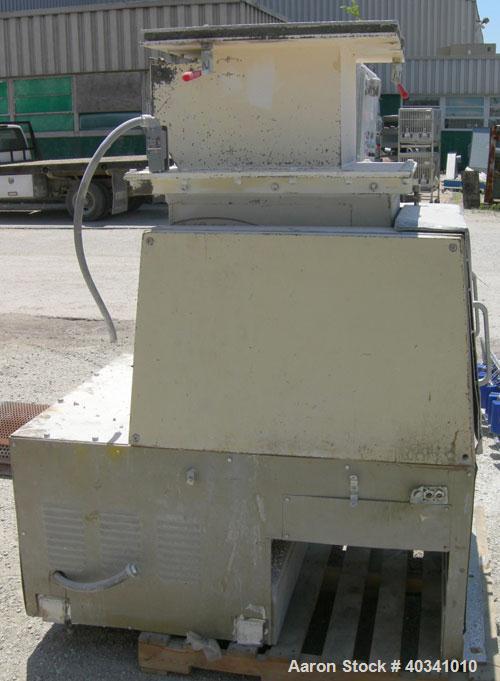 Used Cumberland grinder. Approximately 10" diameter x 24" wide 3 bolt-on blade open rotor. 13" x 19" top feed hopper, bottom discharge with screen. Driven by a 30 hp, 3/60/230/460 volt, 1760 rpm XP m...