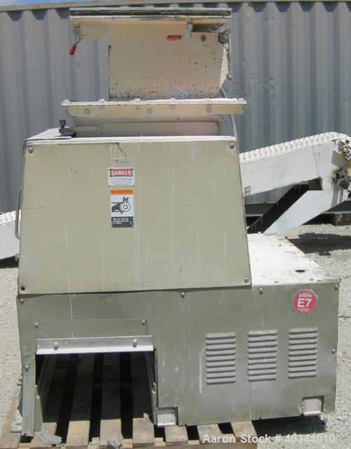 Used Cumberland grinder. Approximately 10" diameter x 24" wide 3 bolt-on blade open rotor. 13" x 19" top feed hopper, bottom discharge with screen. Driven by a 30 hp, 3/60/230/460 volt, 1760 rpm XP m...