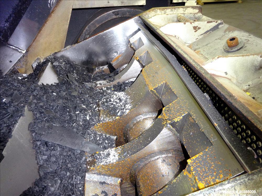 Used Grinder, Carbon Steel. Approximate 15" x 26" wide feed opening with tilt back pelican feed hopper. (3) bolt on tip blades, open rotor. Driven by a 75 hp, 3/60/230/460 volt, 1775 rpm motor. 1/2" ...