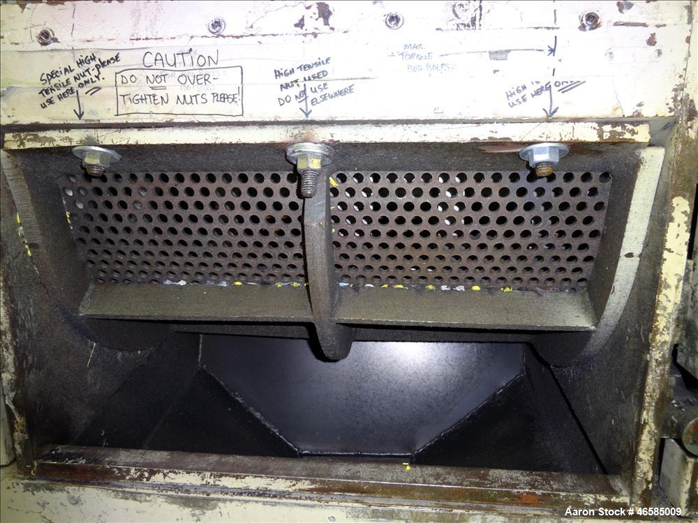 Used Grinder, Carbon Steel. Approximate 15" x 26" wide feed opening with tilt back pelican feed hopper. (3) bolt on tip blades, open rotor. Driven by a 75 hp, 3/60/230/460 volt, 1775 rpm motor. 1/2" ...