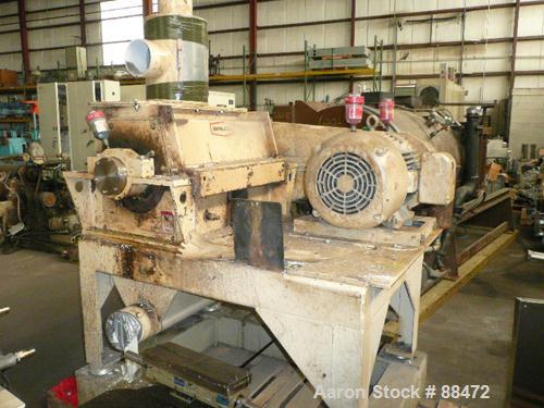 Used Entoleter Film Grinder, Model 1530F. Approximate 15" diameter x 30" wide 7 blade open rotor. Approximately 8" x 30" feed throat with a film hopper, set up for bottom blower discharge. Approximat...