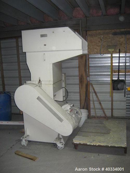 Used Hamilton/Tria Grinder, model 60-35TD. Approximate 12" diameter x 24" wide 3 bolt on blade open rotor, (2) bed knives. Tilt back pelican style feed hopper, bottom discharge drawer. Approximate 3/...