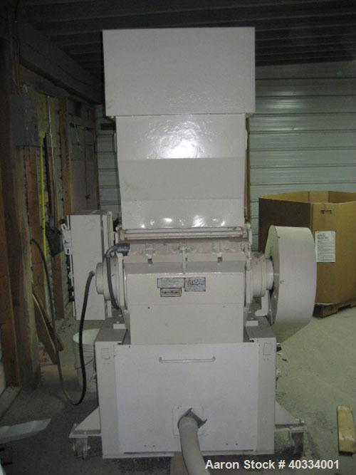 Used Hamilton/Tria Grinder, model 60-35TD. Approximate 12" diameter x 24" wide 3 bolt on blade open rotor, (2) bed knives. Tilt back pelican style feed hopper, bottom discharge drawer. Approximate 3/...