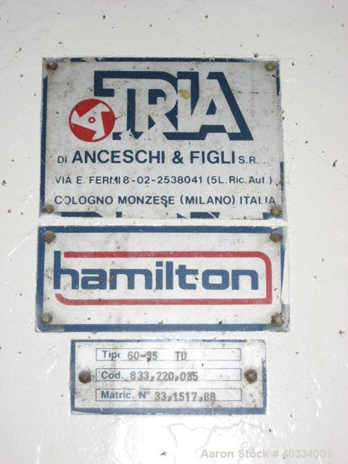 Used Hamilton/Tria Grinder, model 60-35TD. Approximate 12" diameter x 24" wide 3 bolt on blade open rotor, (2) bed knives. Tilt back pelican style feed hopper, bottom discharge drawer. Approximate 3/...