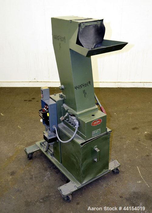 Used IMS Plastic Grinder, Model M-3, Carbon Steel. Approximate 6" diameter x 7" wide feed opening with a tilt back pelican feed hopper. (2) Bolt on blade closed rotor, approximate 3/16" diameter scre...