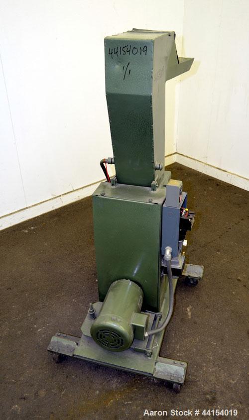 Used IMS Plastic Grinder, Model M-3, Carbon Steel. Approximate 6" diameter x 7" wide feed opening with a tilt back pelican feed hopper. (2) Bolt on blade closed rotor, approximate 3/16" diameter scre...