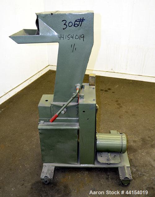 Used IMS Plastic Grinder, Model M-3, Carbon Steel. Approximate 6" diameter x 7" wide feed opening with a tilt back pelican feed hopper. (2) Bolt on blade closed rotor, approximate 3/16" diameter scre...