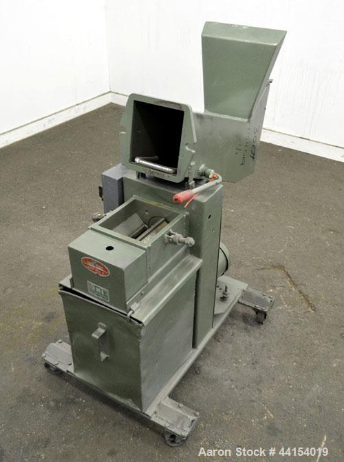 Used IMS Plastic Grinder, Model M-3, Carbon Steel. Approximate 6" diameter x 7" wide feed opening with a tilt back pelican feed hopper. (2) Bolt on blade closed rotor, approximate 3/16" diameter scre...