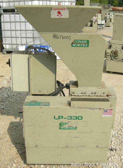 Used Conair/Wortex Granulator, model LP-330. Approximate 6" diameter x 7" wide segmented helical type rotor with 3 rows of 5 blades. 7 3/4" x 7 1/4" carbon steel chamber. 24" x 24" top feed opening. ...