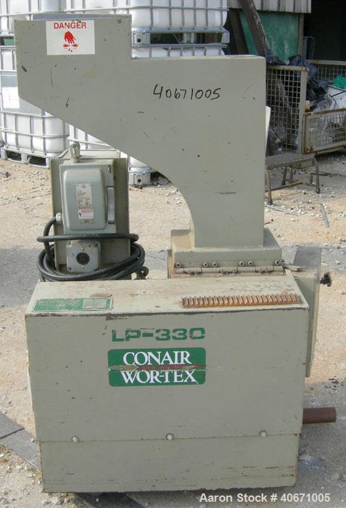 Used Conair/Wortex Granulator, model LP-330. Approximate 6" diameter x 7" long segmented helical type rotor with 3 rows of 5 blades. 7 3/4" x 7 1/4" carbon steel chamber. 12" x 12" top feed opening. ...