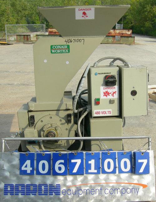 Used Conair/Wortex Granulator, model LP-330. Approximate 6" diameter x 7" long segmented helical type rotor with 3 rows of 5 blades. 7 3/4" x 7 1/4" carbon steel chamber. 24" x 24" top feed opening. ...