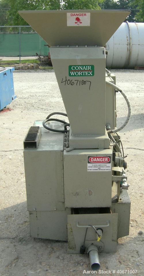 Used Conair/Wortex Granulator, model LP-330. Approximate 6" diameter x 7" long segmented helical type rotor with 3 rows of 5 blades. 7 3/4" x 7 1/4" carbon steel chamber. 24" x 24" top feed opening. ...