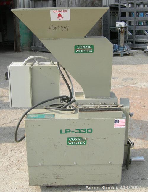 Used Conair/Wortex Granulator, model LP-330. Approximate 6" diameter x 7" long segmented helical type rotor with 3 rows of 5 blades. 7 3/4" x 7 1/4" carbon steel chamber. 24" x 24" top feed opening. ...