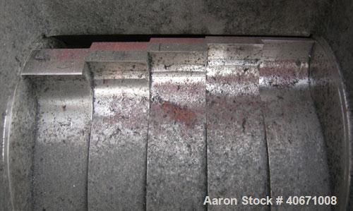 Used Conair/Wortex Granulator, model LP-330. Approximate 6" diameter x 7" long segmented helical type rotor with 3 rows of 5 blades. 7 3/4" x 7 1/4" carbon steel chamber. 16" x 24" top feed opening. ...