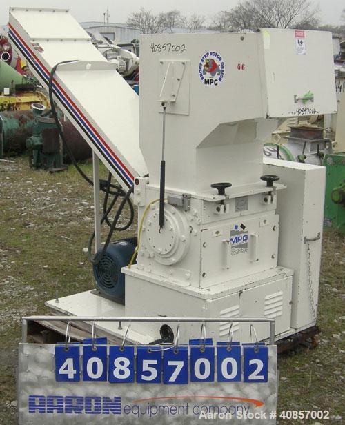 Used MPG Granulator, Model GP-1220HB. Approximately 10" diameter x 24" wide, 3 rows of 2 bolt on slanted blade open rotor. Tilt back pelican style feed hopper with sheet feed, set up for blower disch...