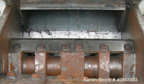 Used MPG Granulator, Model GP-1220HB. Approximately 10" diameter x 24" wide, 3 rows of 2 bolt on slanted blade open rotors. Tilt back pelican style feed hopper with sheet feed, set up for blower disc...