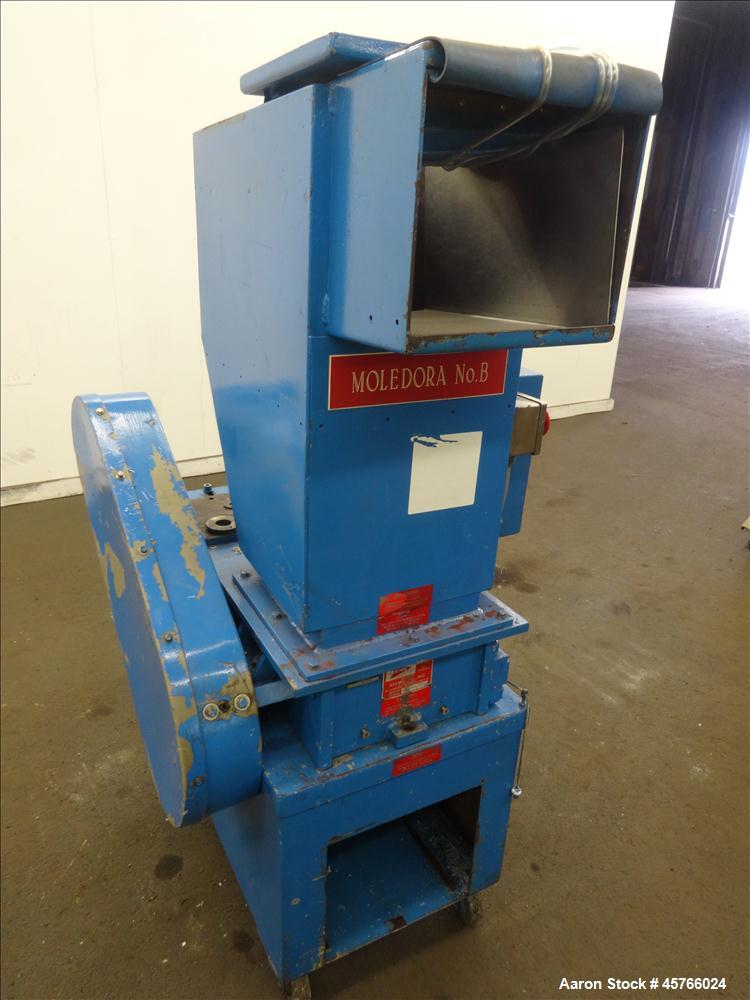 Used Nelmor Grinder, Model 1012RG11. Tilt back hopper. 13" Wide chamber with open rotor, 3 bolt on blades and 1/4" screen holes. Bottom discharge drawer. No motor. Serial#25924.