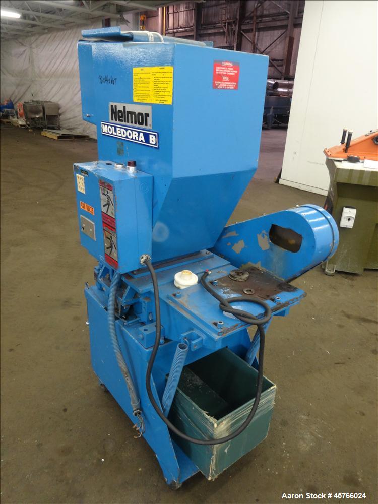 Used Nelmor Grinder, Model 1012RG11. Tilt back hopper. 13" Wide chamber with open rotor, 3 bolt on blades and 1/4" screen holes. Bottom discharge drawer. No motor. Serial#25924.