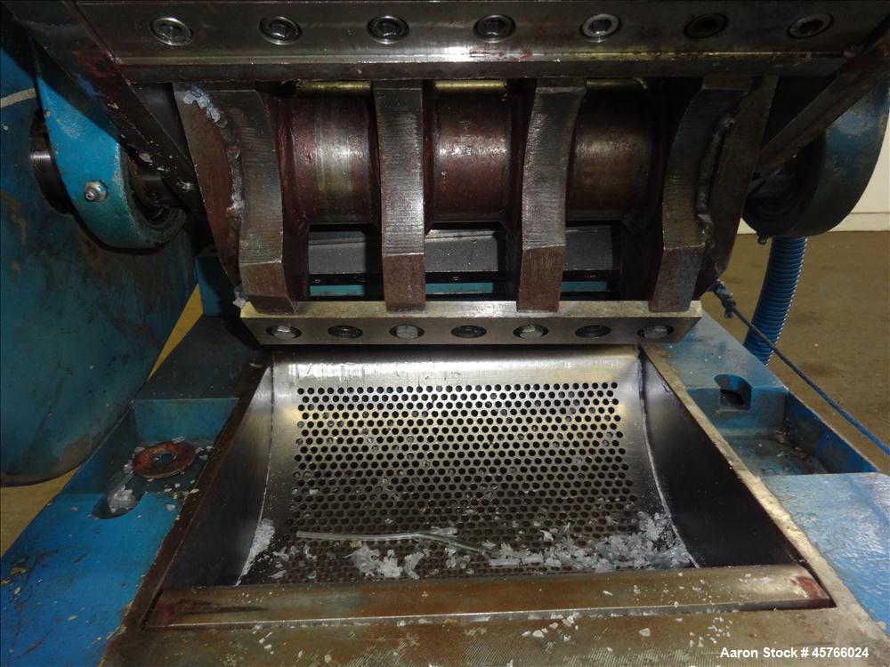 Used Nelmor Grinder, Model 1012RG11. Tilt back hopper. 13" Wide chamber with open rotor, 3 bolt on blades and 1/4" screen holes. Bottom discharge drawer. No motor. Serial#25924.