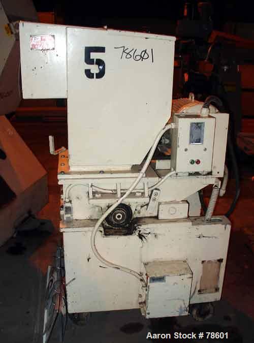 USED:Nelmor grinder, model G1215MI, 2 bolt-on knives, open rotor,approx 1/4" screen holes, pelican style feed, bottom discharge,driven by a 15 hp, 3/60/230/460 volt, 1755 rpm motor. Mounted oncasters...
