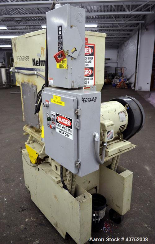 Used Nelmore Granulator, Model G1215P1. Approximately 12" diameter x 15" wide 3 bolt-on blade closed rotor. Tilt back pelican style feed hopper, set up for bottom discharge with drawer. Approximately...