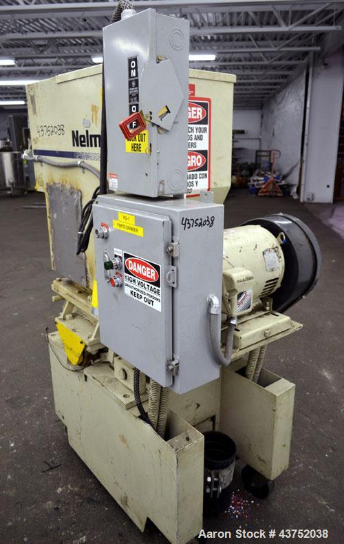 Used- Nelmore Granulator, Model G1215P1. Approximately 12" diameter x 15" wide 3 bolt-on blade closed rotor. Tilt back pelic...