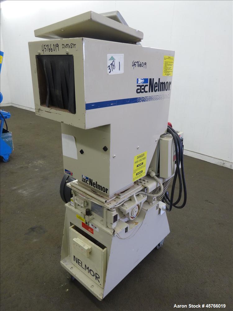 Used AEC Nelmor Grinder, Model G810P1. Tilt back hopper, open rotor with 3 bolt on blades, 9-1/2" long driven by a 7.5 hp, 3/60/208-230/460 volt, 1745 rpm motor. Screen has 5/16" diameter holes. Bott...