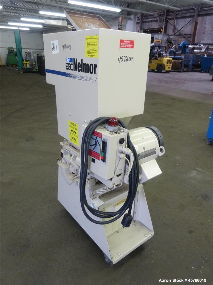 Used AEC Nelmor Grinder, Model G810P1. Tilt back hopper, open rotor with 3 bolt on blades, 9-1/2" long driven by a 7.5 hp, 3/60/208-230/460 volt, 1745 rpm motor. Screen has 5/16" diameter holes. Bott...