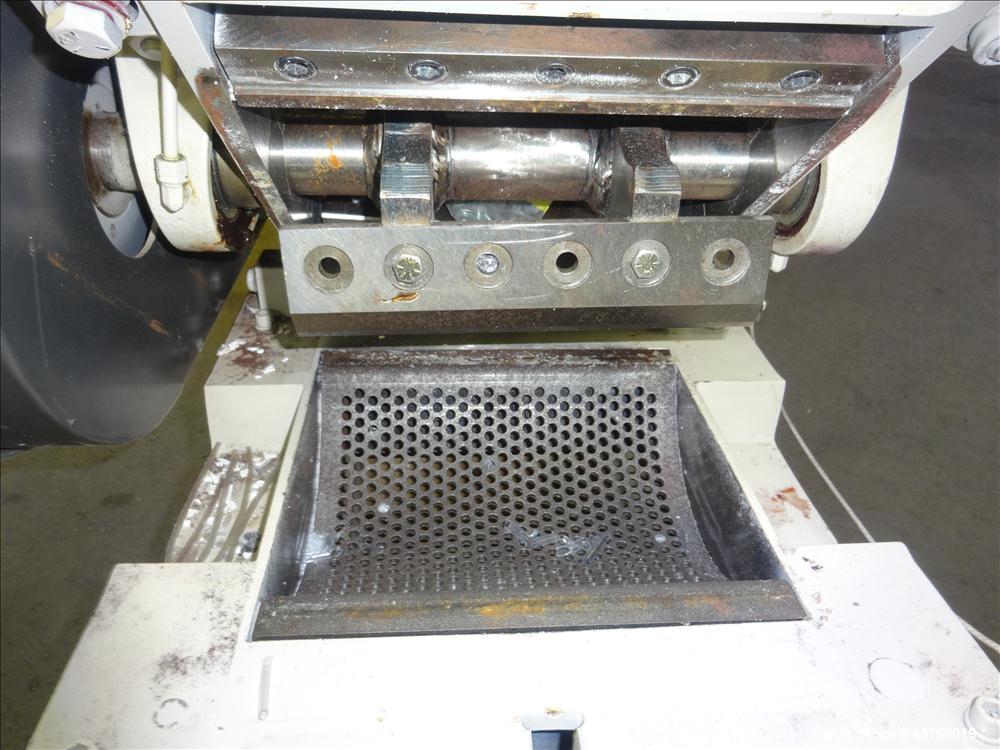 Used AEC Nelmor Grinder, Model G810P1. Tilt back hopper, open rotor with 3 bolt on blades, 9-1/2" long driven by a 7.5 hp, 3/60/208-230/460 volt, 1745 rpm motor. Screen has 5/16" diameter holes. Bott...