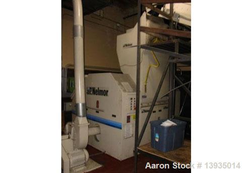 Used 1999 Nelmore RG2244. 22" x 44", 3 blade open rotor, 2 bed knives per seat, 100 hp, live bottom, metal detector, fine separation, sound enclosure, blower and cyclone, conveyor.