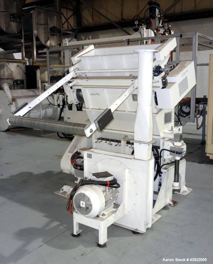Used OMV (TRIA) Granulator, Built 2004. Model TR900. Approximate 12" diameter x 38" wide two roll feed. Driven by a 1.1 KW Drive. Rolls are grooved. Grinder has (4) knives, with open style rotor. Eac...