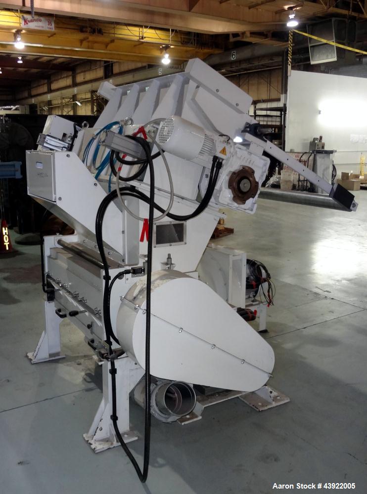 Used OMV (TRIA) Granulator, Built 2004. Model TR900. Approximate 12" diameter x 38" wide two roll feed. Driven by a 1.1 KW Drive. Rolls are grooved. Grinder has (4) knives, with open style rotor. Eac...